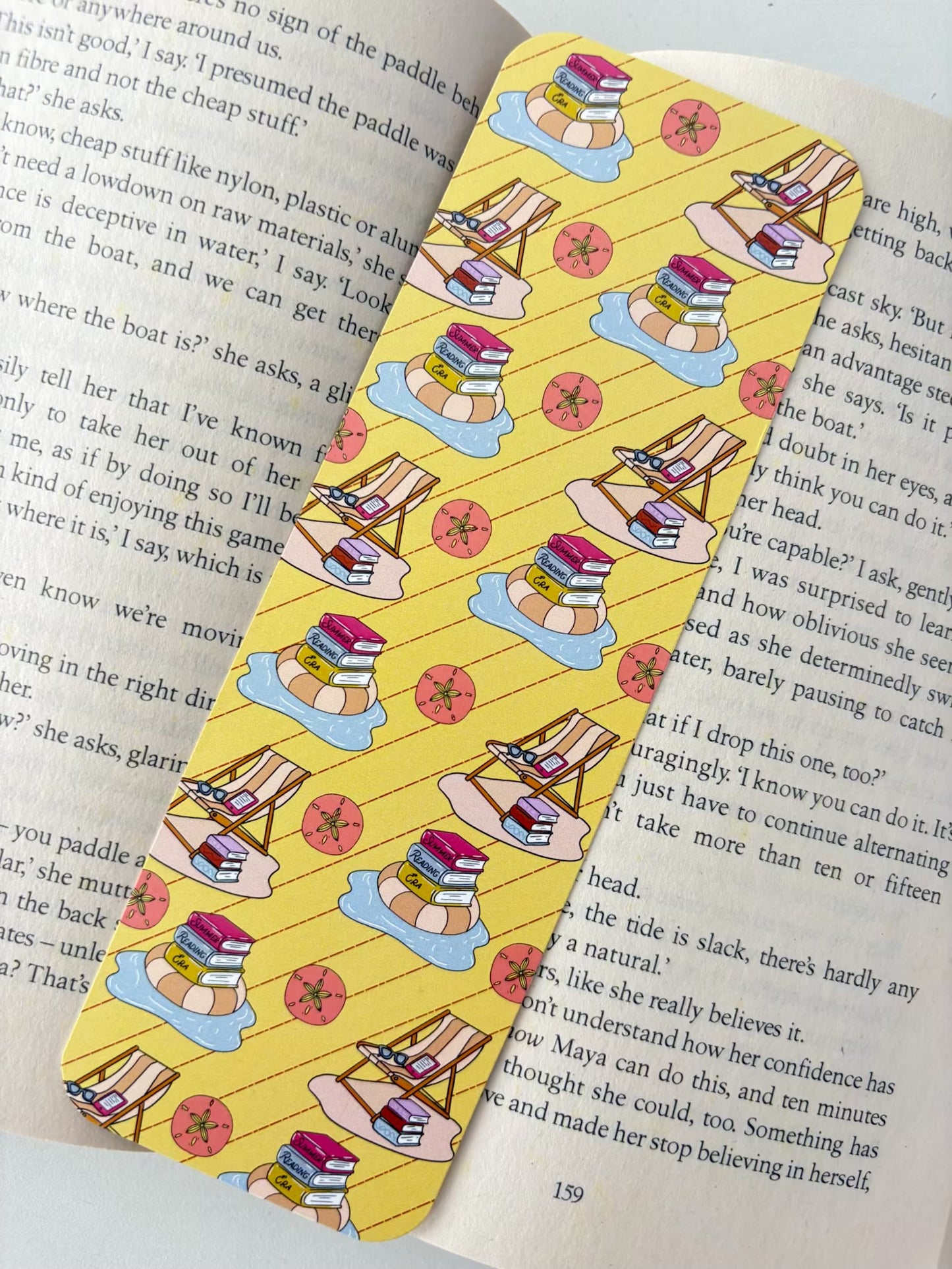 Reading by the beach bookmark