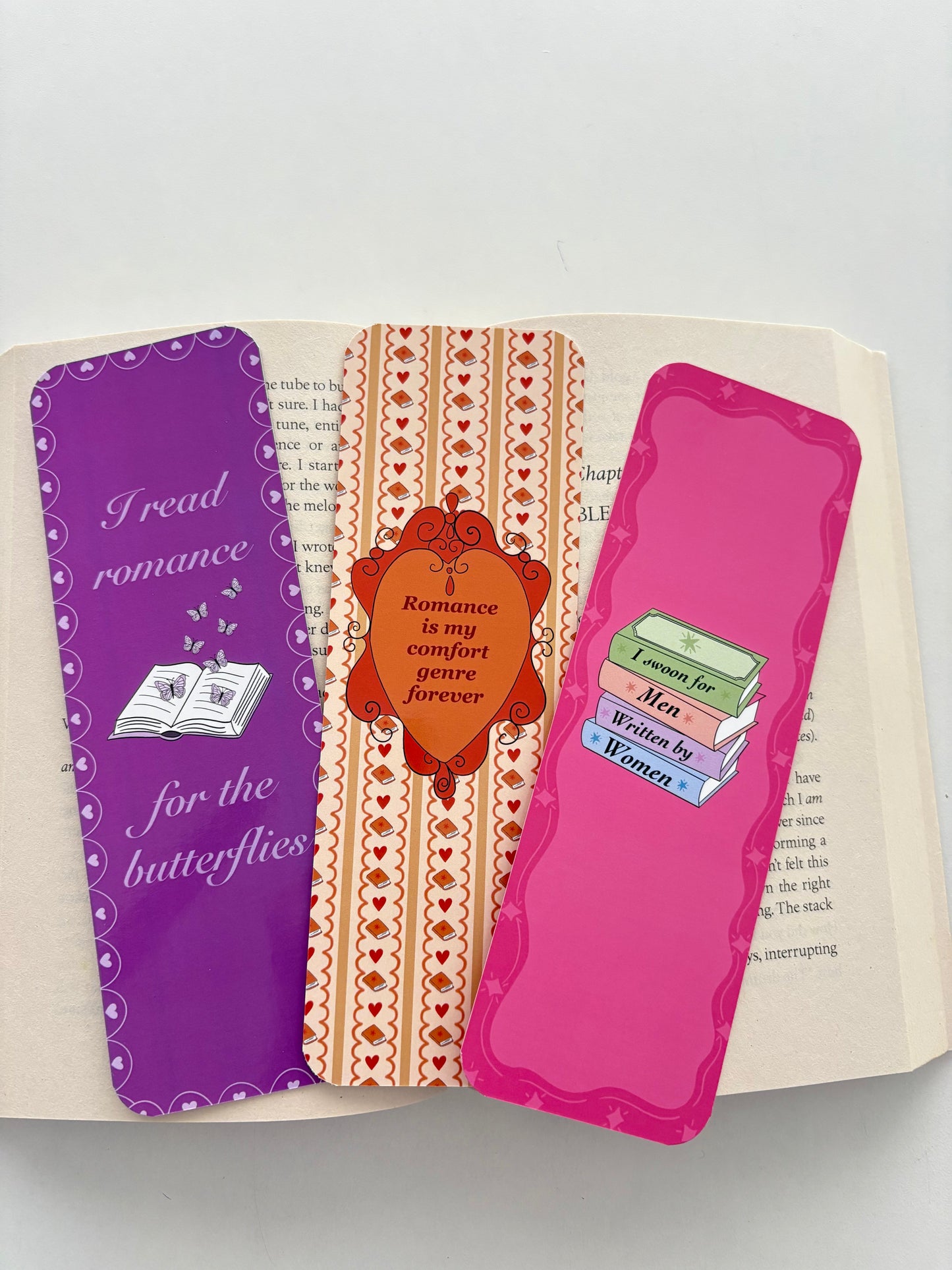 I swoon for men written by women bookmark, Romance is my comfort genre bookmark, Read romance for the butterflies bookmark
